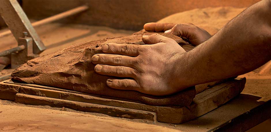 throw clay onto the wooden mould