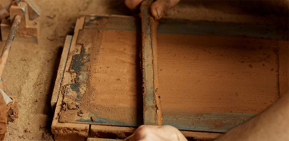 flattening tile on the wooden mould